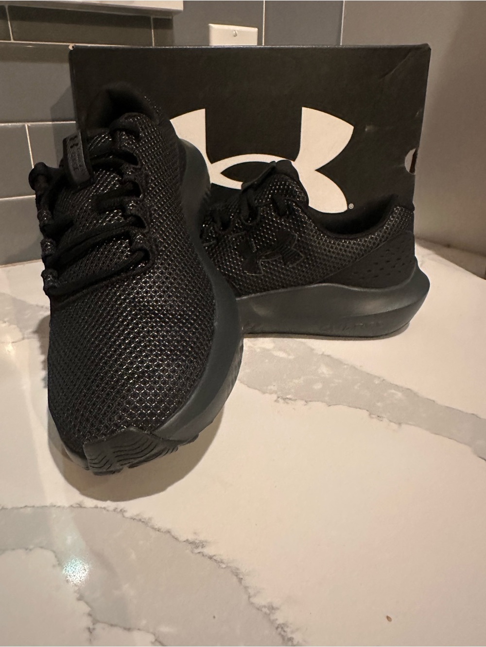 Under Armour Mens Charged Surge 4 All Black Athletic Sneakers